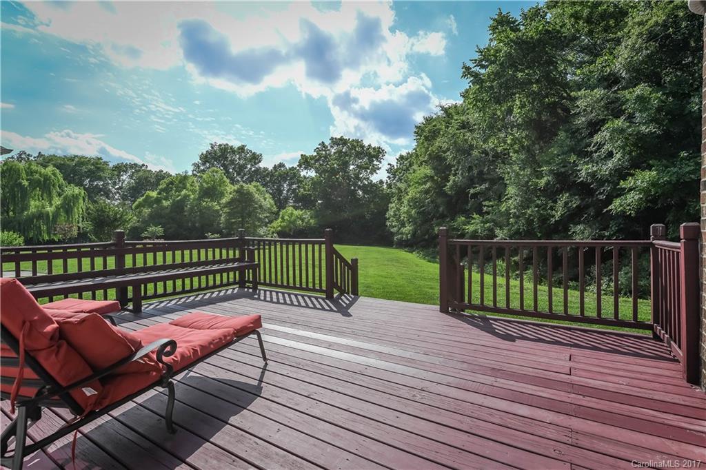 10944 Round Rock Road Charlotte, NC 28277 - Photo 23 of 23 a view of a wooden deck with a bench
