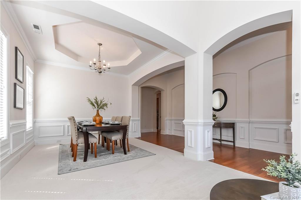 10944 Round Rock Road Charlotte, NC 28277 - Photo 7 of 23 a view of a dining room with furniture and chandelier