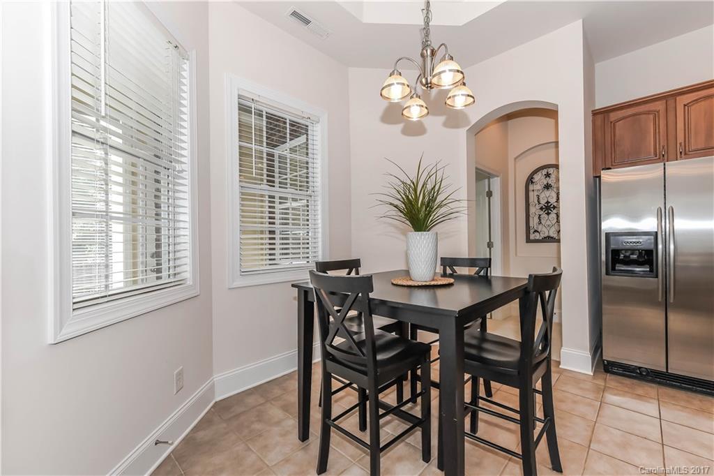 10944 Round Rock Road Charlotte, NC 28277 - Photo 9 of 23 a view of a dining room with furniture and chandelier