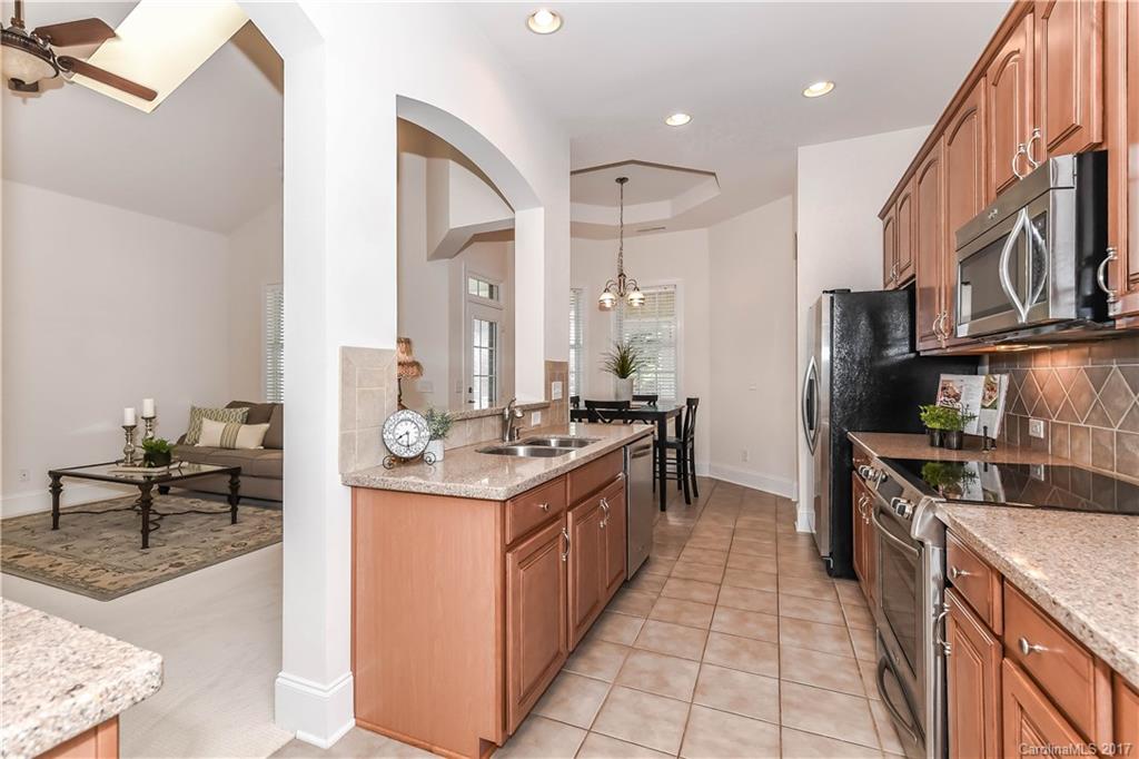 10944 Round Rock Road Charlotte, NC 28277 - Photo 10 of 23 a kitchen with stainless steel appliances granite countertop a stove and a sink