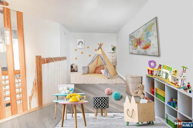 a living room with furniture and wall paintings