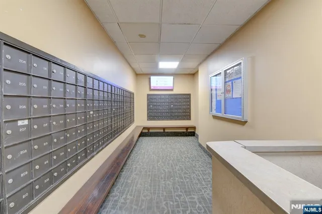 a lobby with furniture and a table