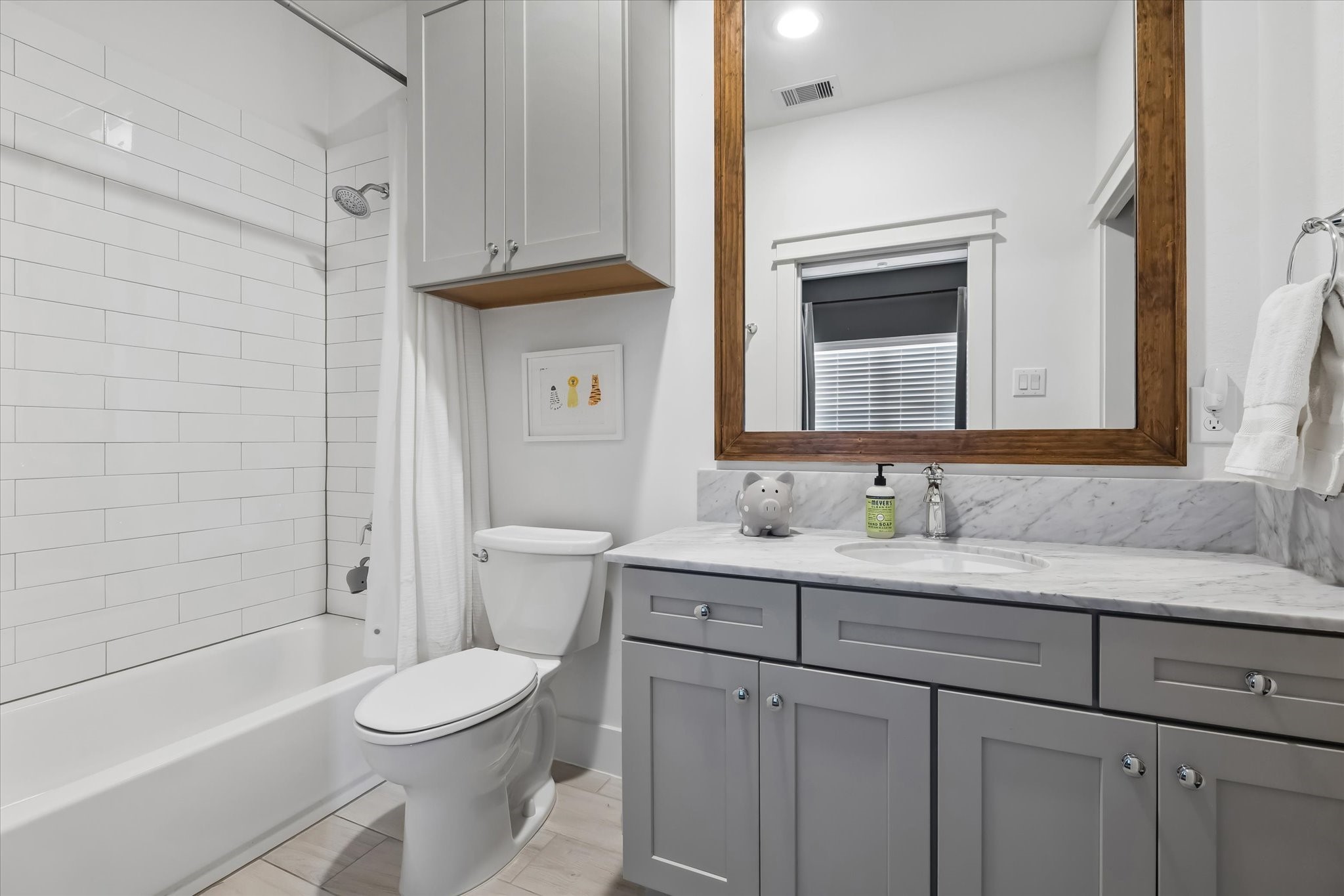 2503 Nicholson Street Houston, TX 77008 - Photo 14 of 22 En-suite bath serving third floor secondary bedroom has great vanity space and storage.