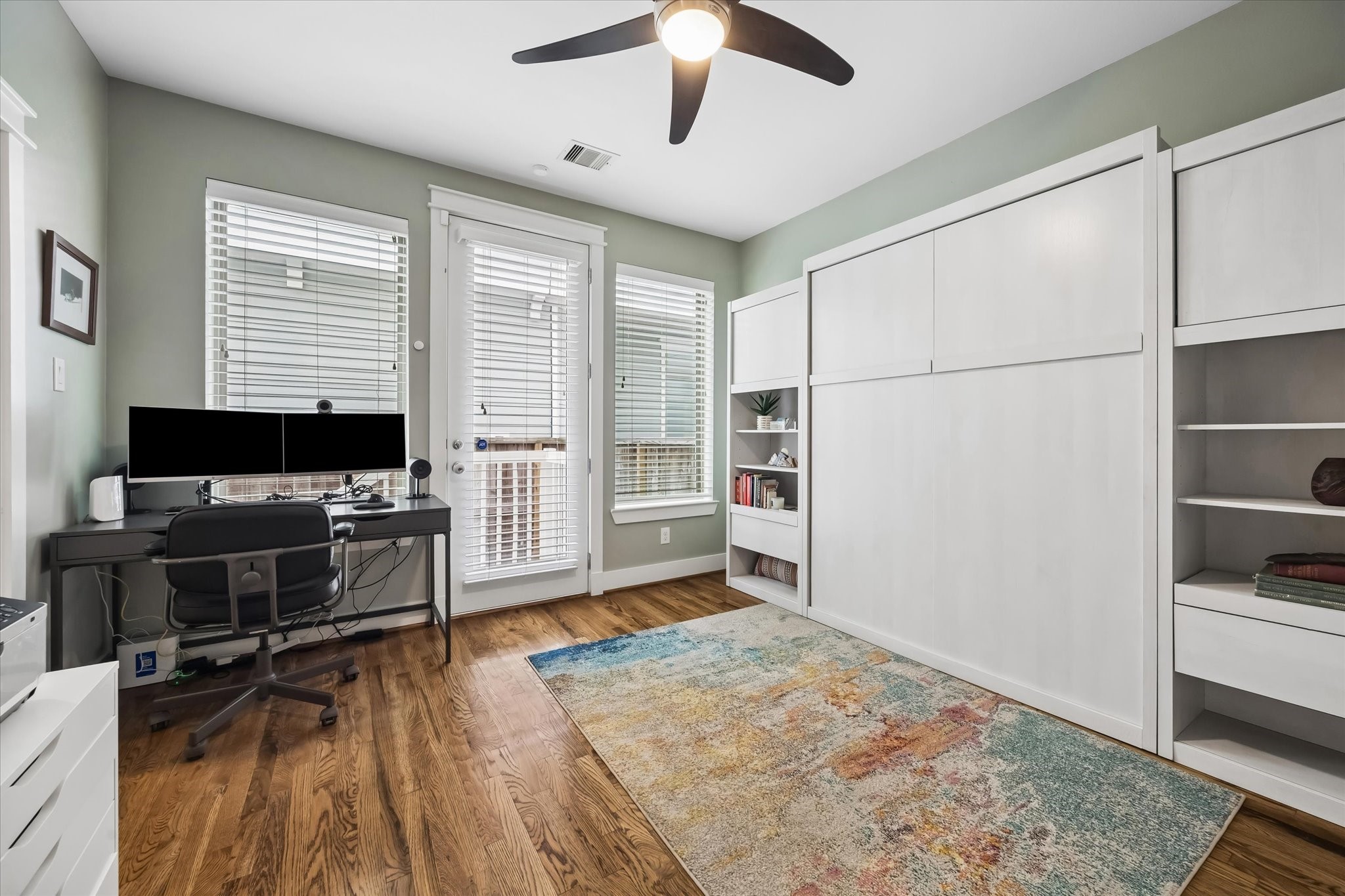2503 Nicholson Street Houston, TX 77008 - Photo 15 of 22 First floor secondary bedroom, currently being utilized as a home office, has door leading to backyard. En-suite bath with shower and large storage closet complete the space.