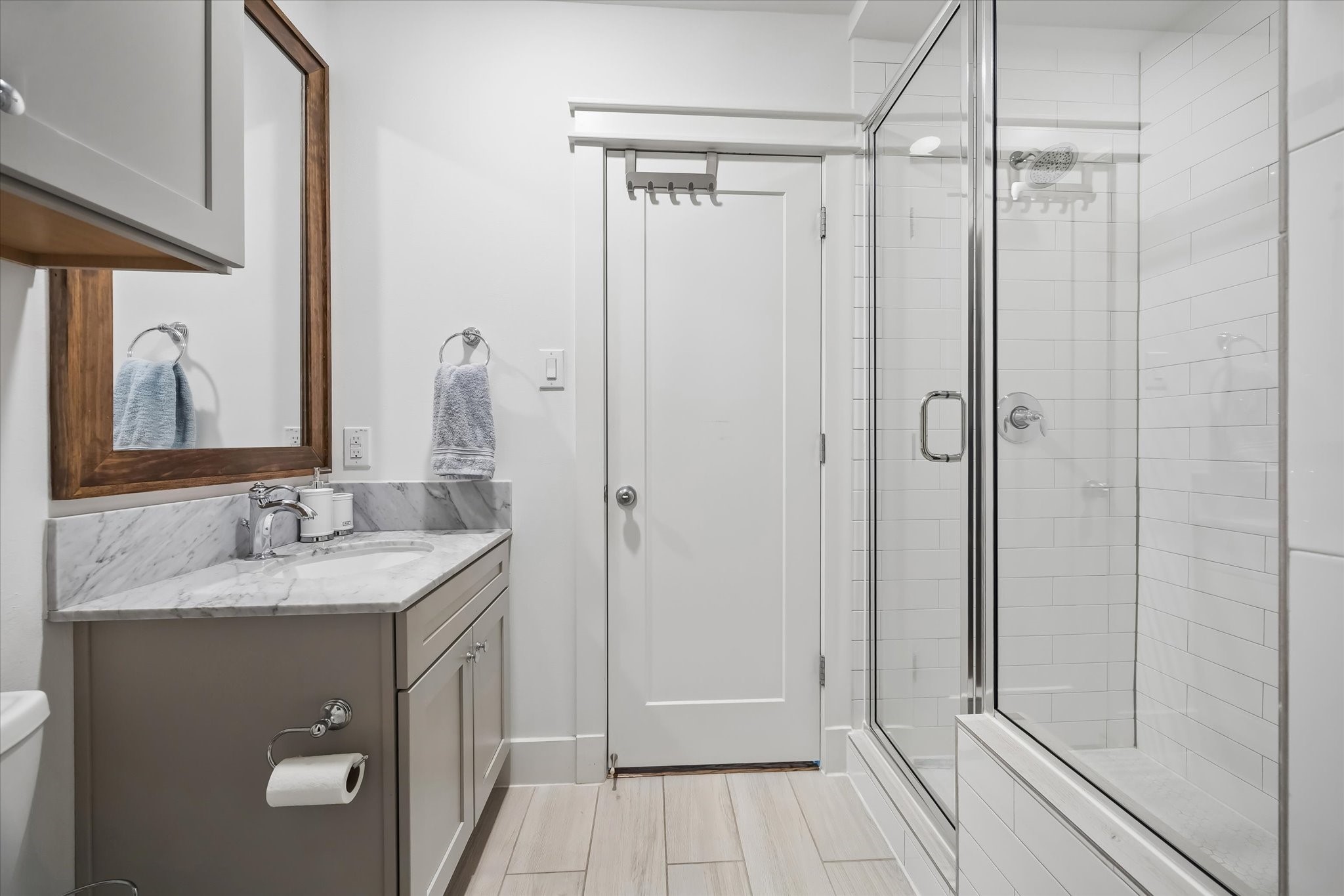 2503 Nicholson Street Houston, TX 77008 - Photo 16 of 22 First floor en-suite bath has shower with glass enclosure, full size vanity with storage.