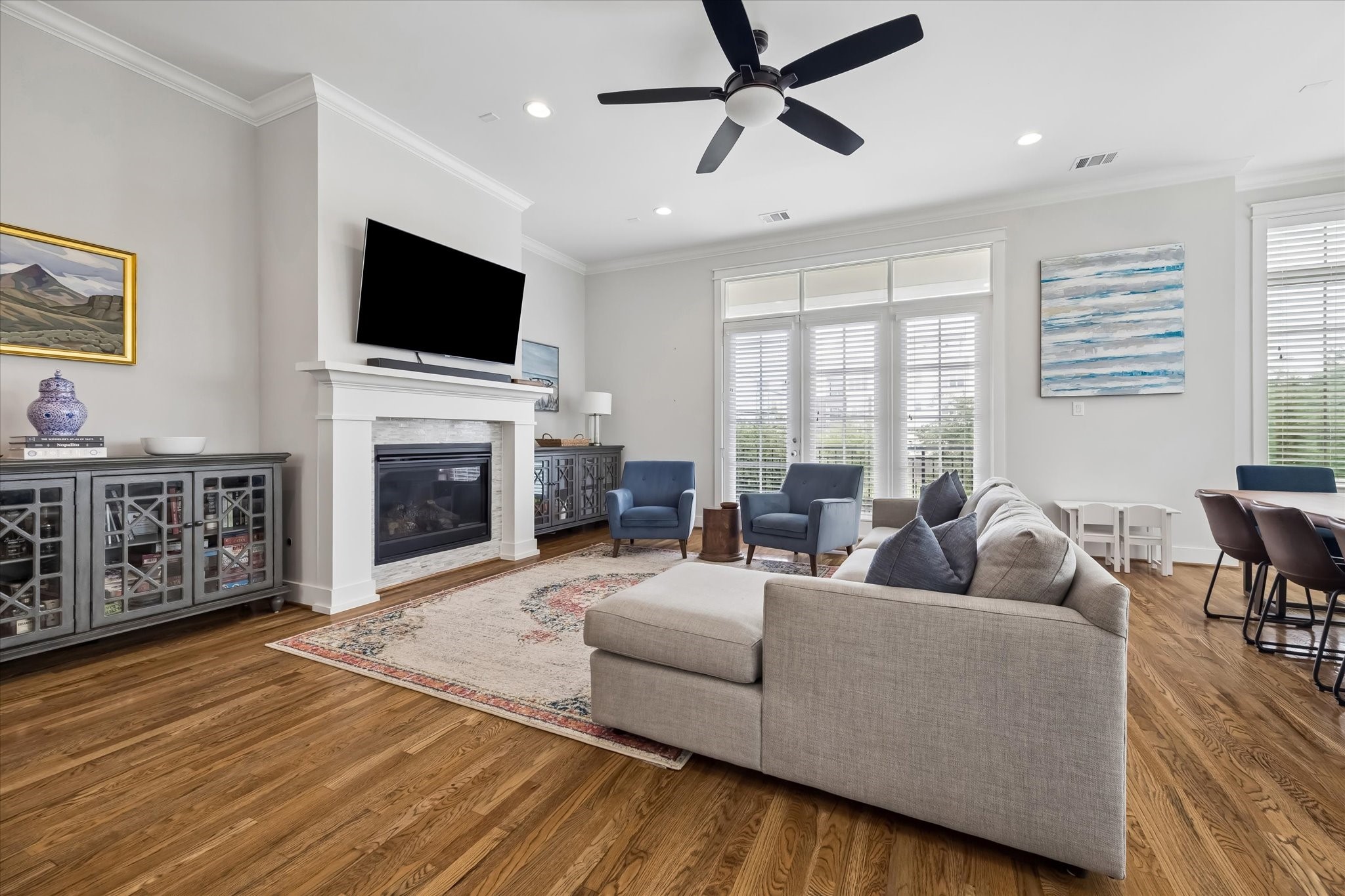 2503 Nicholson Street Houston, TX 77008 - Photo 5 of 22 The living room is anchored by a gas-log fireplace with custom surround. Patio doors lead outside to a nicely sized balcony space overlooking the front of the home.