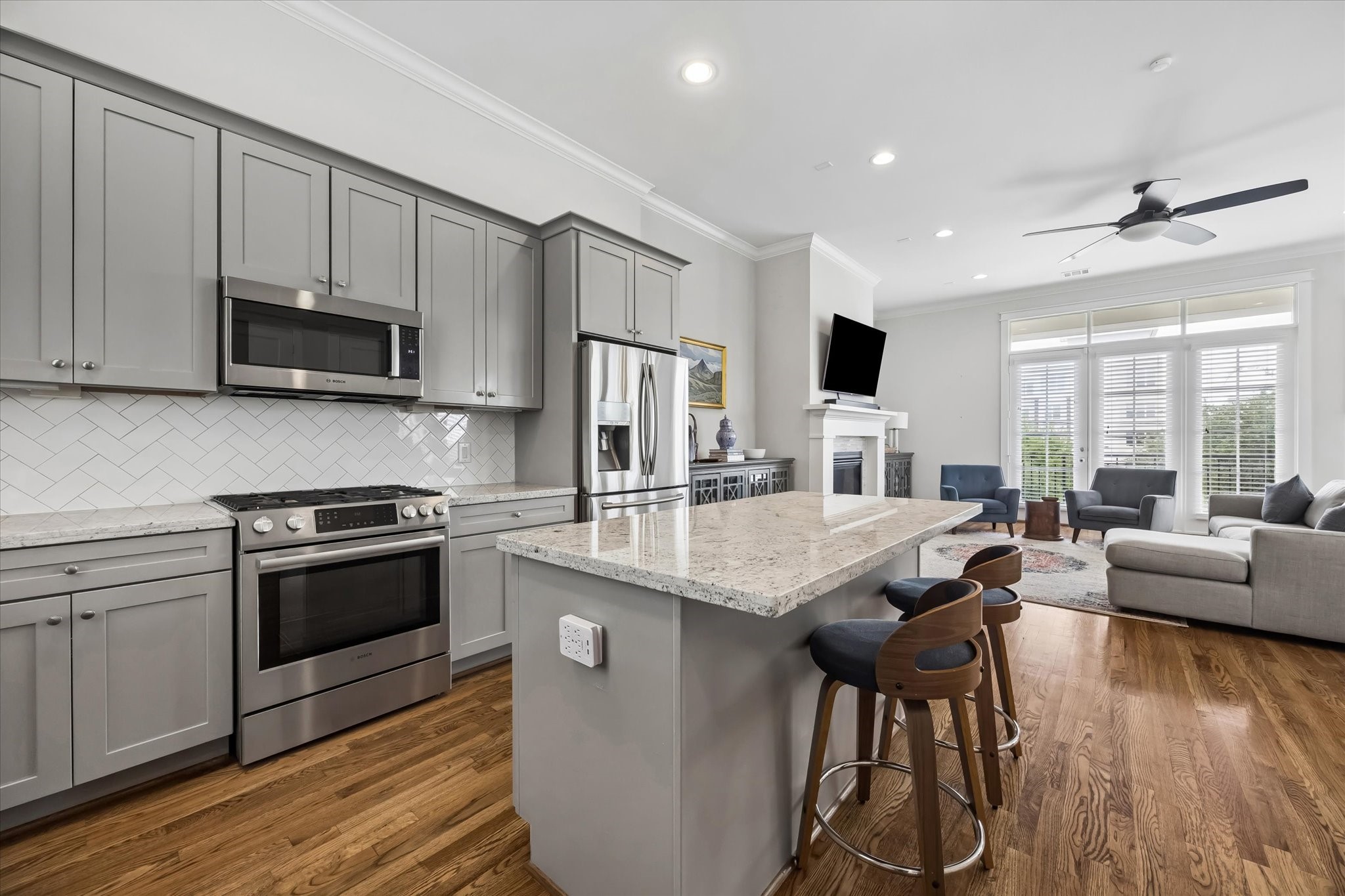 2503 Nicholson Street Houston, TX 77008 - Photo 7 of 22 Kitchen with custom cabinetry features Bosch gas range with convection oven for the most discerning cooks. Island with breakfast bar offers great prep area, buffet counter, or place to enjoy a casual meal.