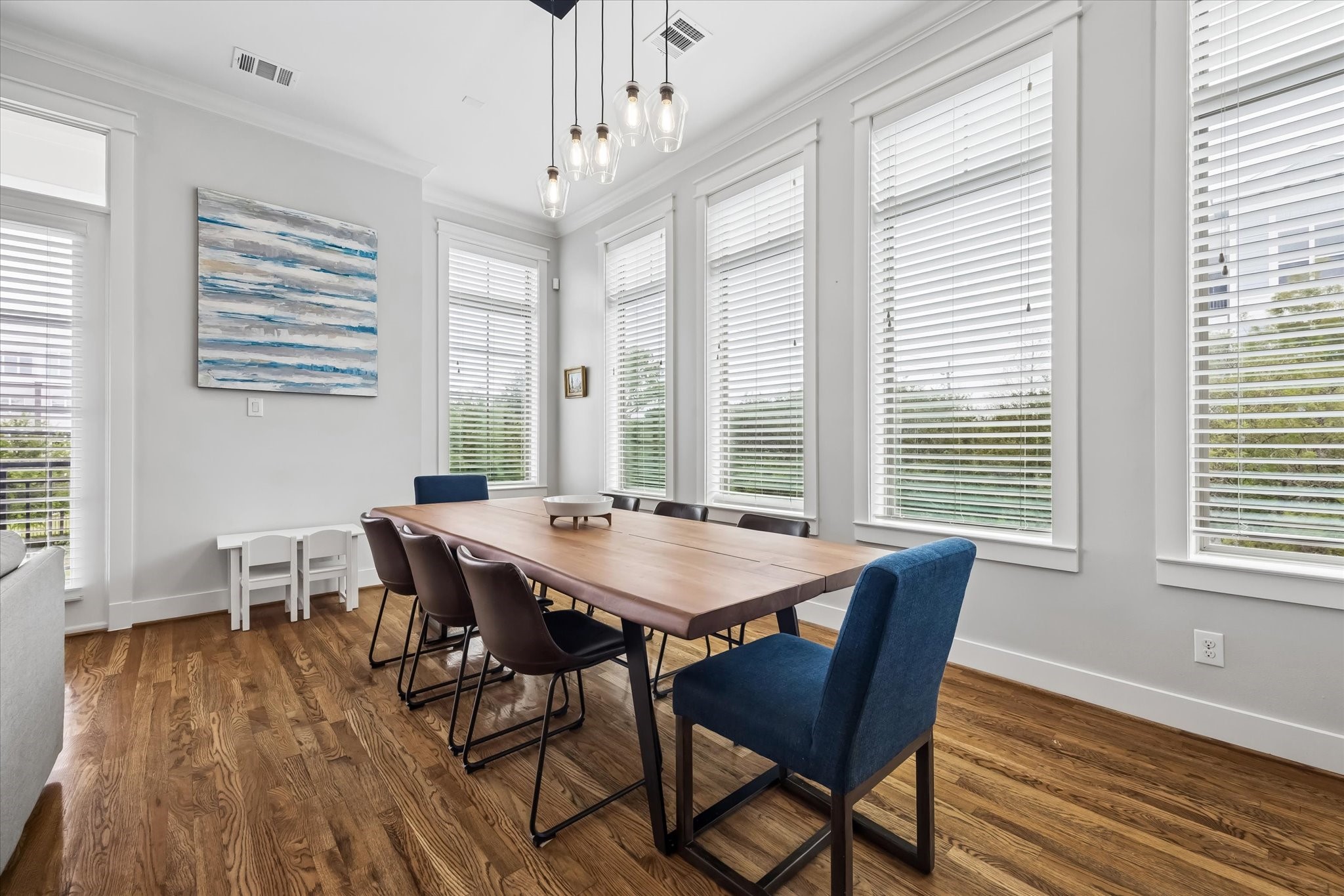 2503 Nicholson Street Houston, TX 77008 - Photo 10 of 22 Dining area enjoys a beautiful view out the many windows. The crown moldings, deep baseboards, and window trims make the room feel complete.