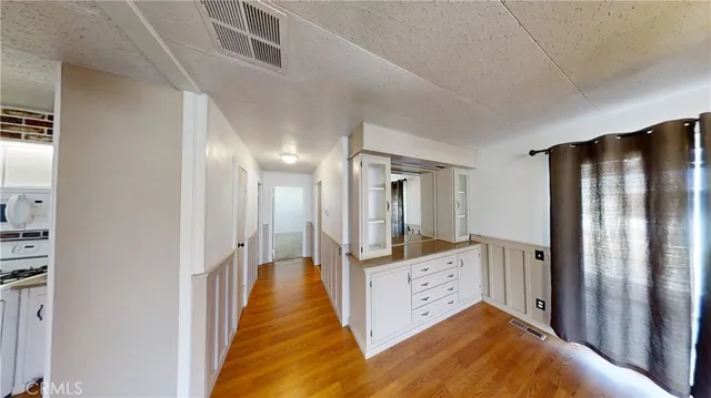 a view of a hallway with closet area