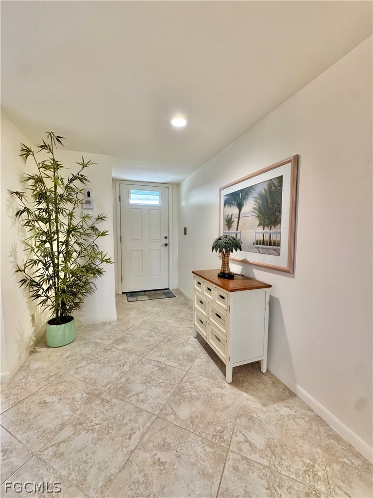 159 Quails Nest Road, Unit 2 Naples, FL 34112 - Photo 2 of 17 a living room with a entryway
