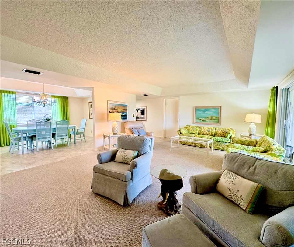 159 Quails Nest Road, Unit 2 Naples, FL 34112 - Photo 5 of 17 a living room with furniture and a large window