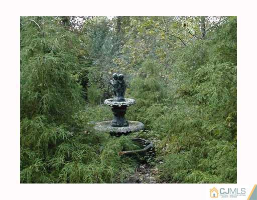 23 Butcher Road Monroe Township, NJ 08831 - Photo 7 of 7 a view of a back yard from a window