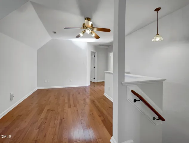 a view of an entryway with wooden floor