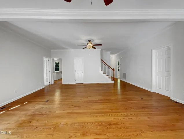 a view of a room with a ceiling fan