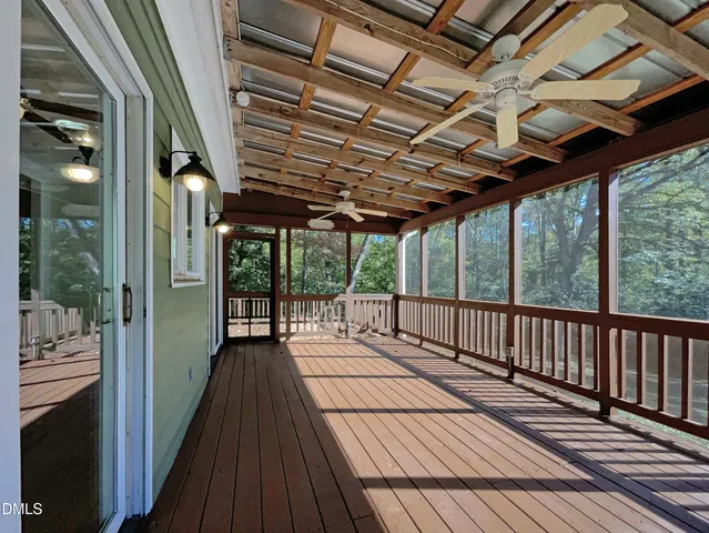 a view of balcony with wooden floor