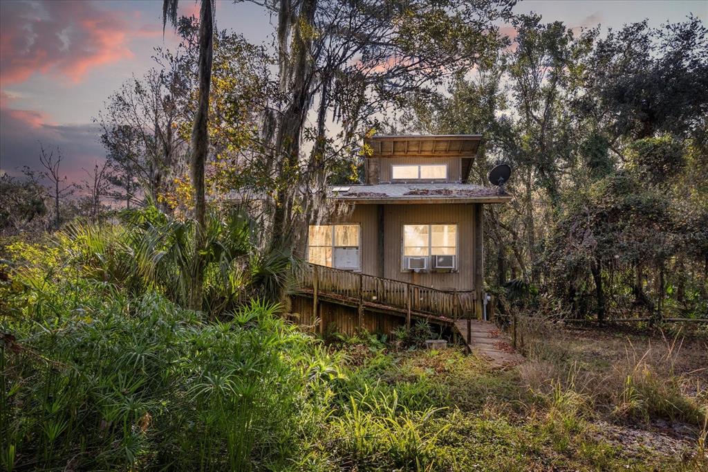 1705 Sunset Trail Geneva, FL 32732 - Photo 19 of 19 a view of a bench in a forest