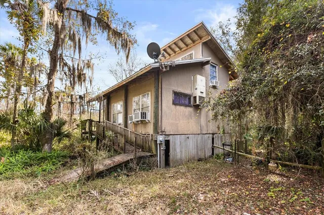 a view of a house with a fence