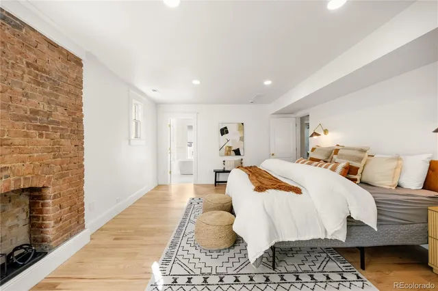 a bedroom with a large bed and a large window