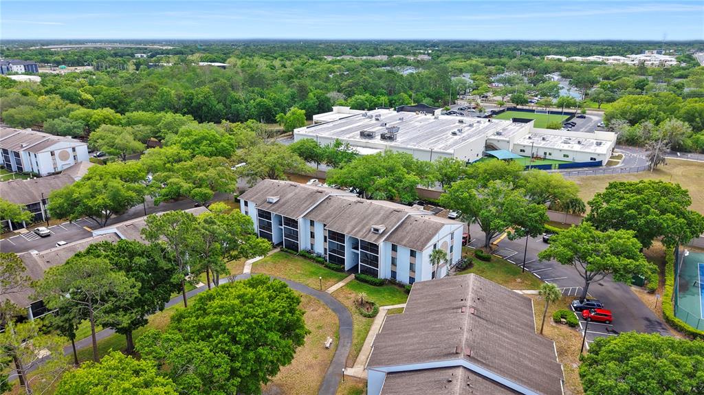 8203 Sun Spring Circle, Unit 62 Orlando, FL 32825 - Photo 18 of 19 an aerial view of a house with a garden
