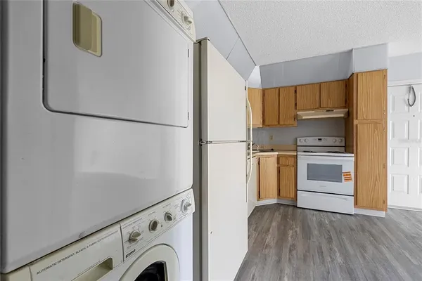 a view of kitchen and wooden floor