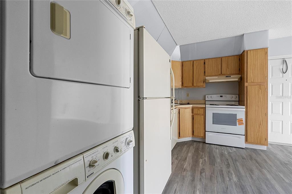 8203 Sun Spring Circle, Unit 62 Orlando, FL 32825 - Photo 8 of 19 a view of kitchen and wooden floor