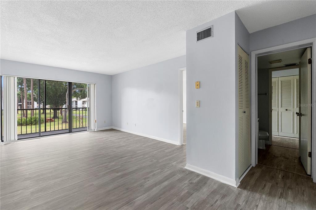 8203 Sun Spring Circle, Unit 62 Orlando, FL 32825 - Photo 9 of 19 a view of a room with wooden floor and a window