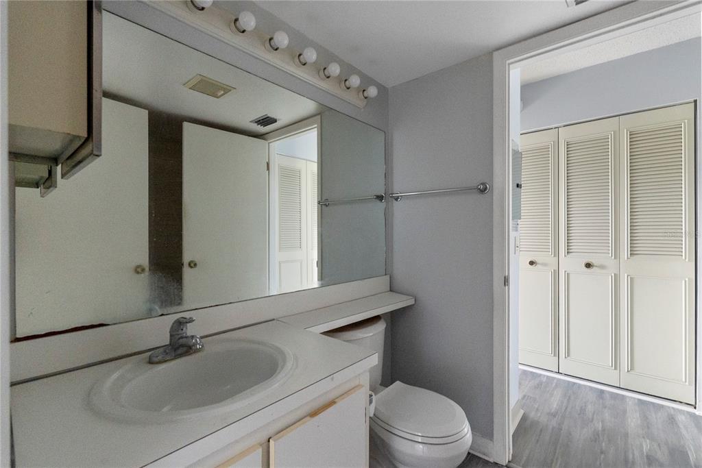 8203 Sun Spring Circle, Unit 62 Orlando, FL 32825 - Photo 10 of 19 a bathroom with a sink toilet vanity and shower