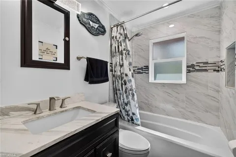 a room with gym equipment and windows