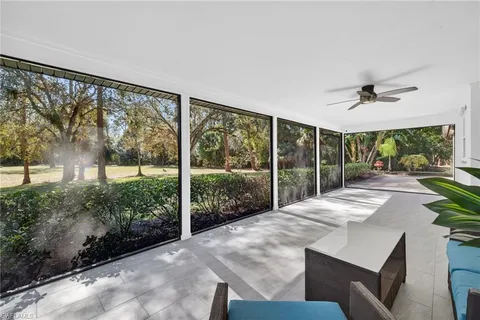 a view of a backyard with large trees