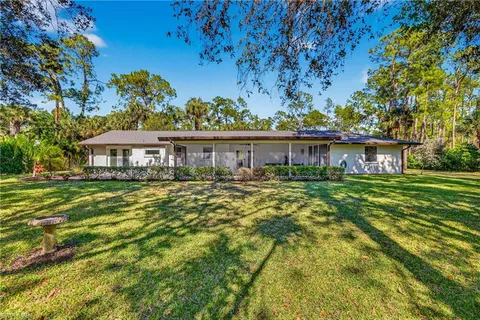 a view of a house with snow in the yard
