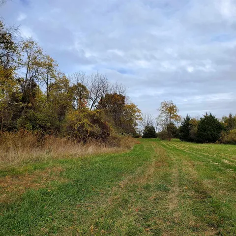 a view of a lake with houses in the back