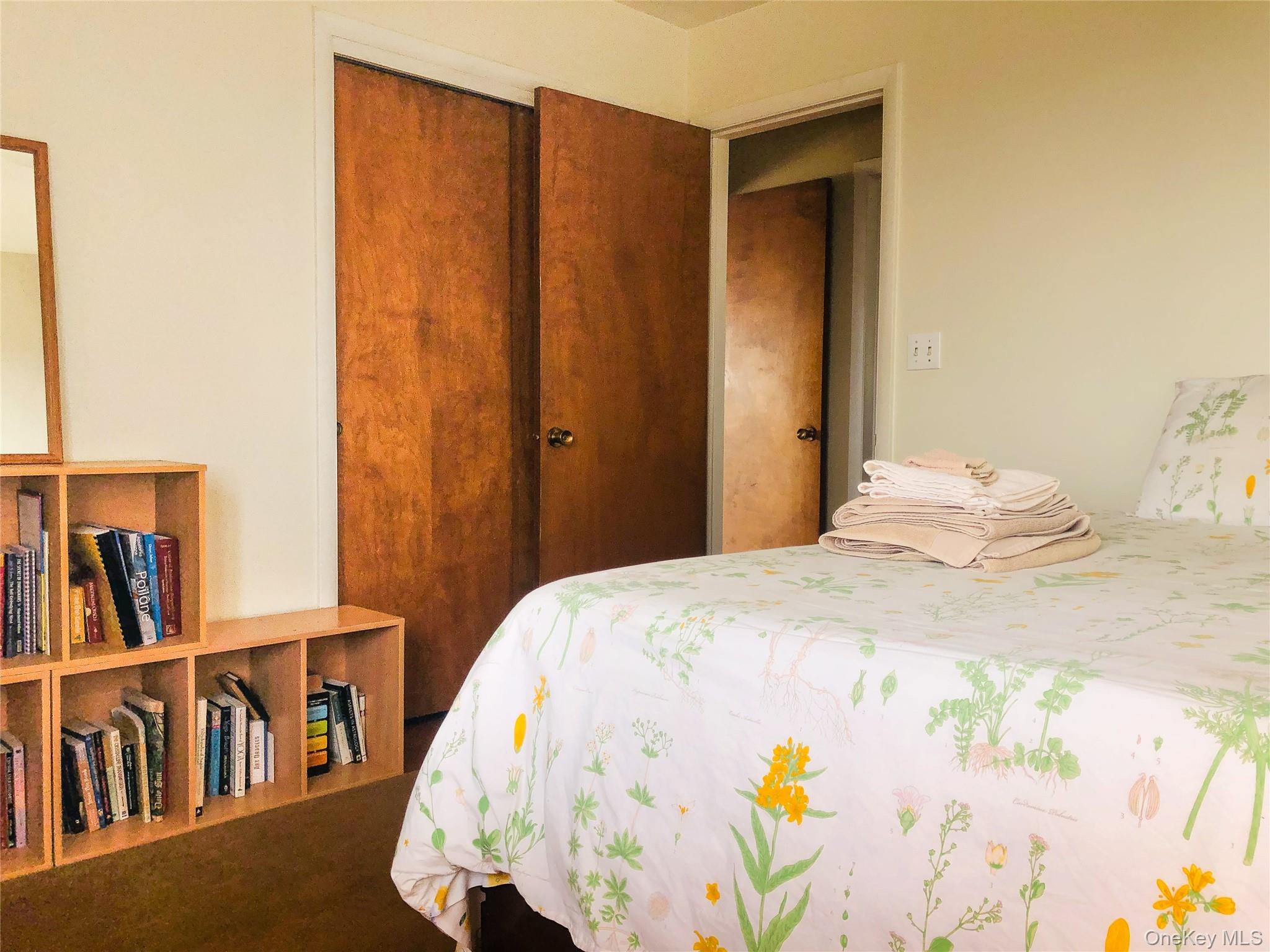 68-78 Ridge Road Clinton Corners, NY 12514 - Photo 29 of 50 a bedroom with a bed and a book shelf