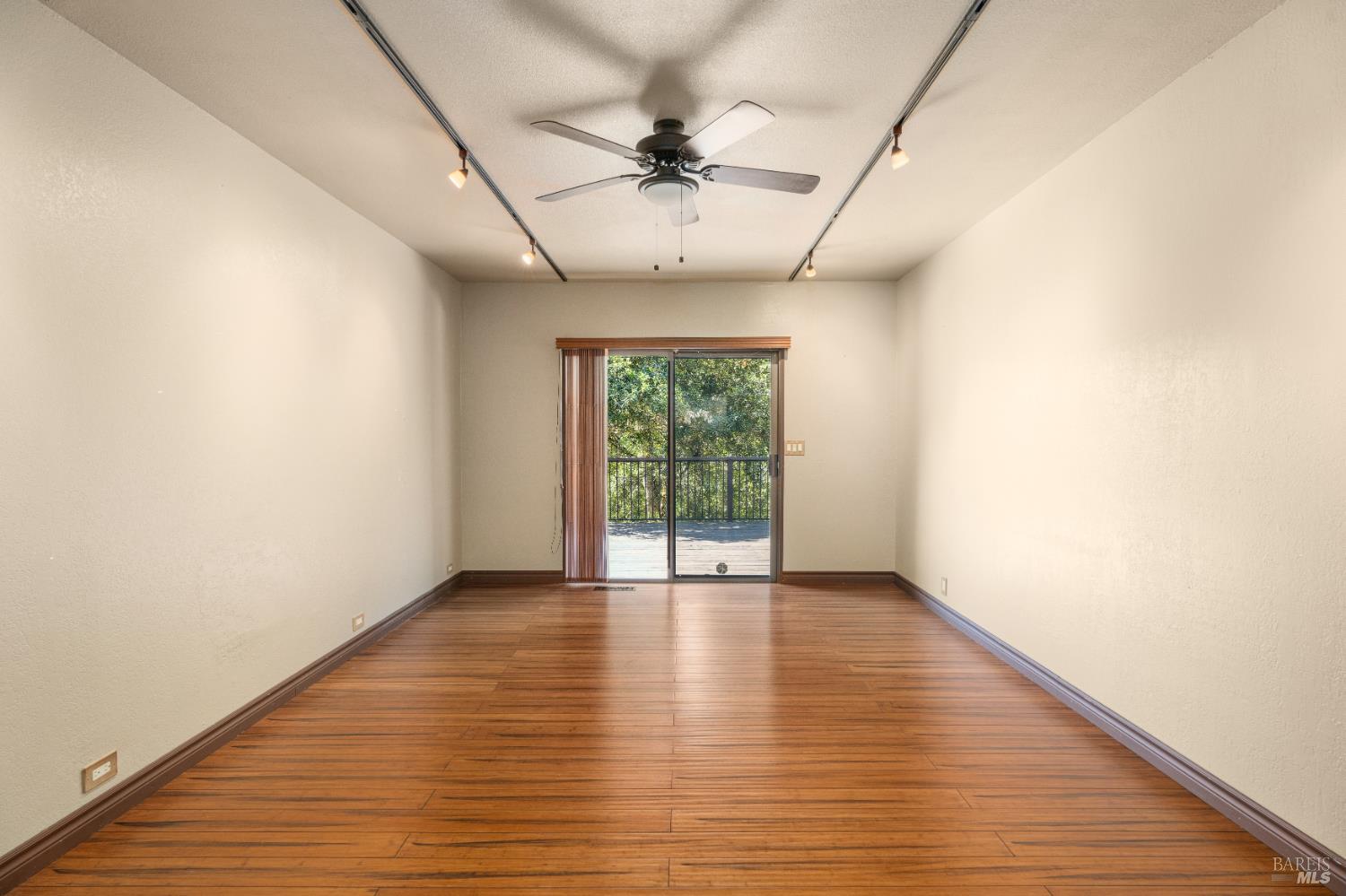 888 Watson Road Ukiah, CA 95482 - Photo 12 of 39 wooden floor in an empty room with a window