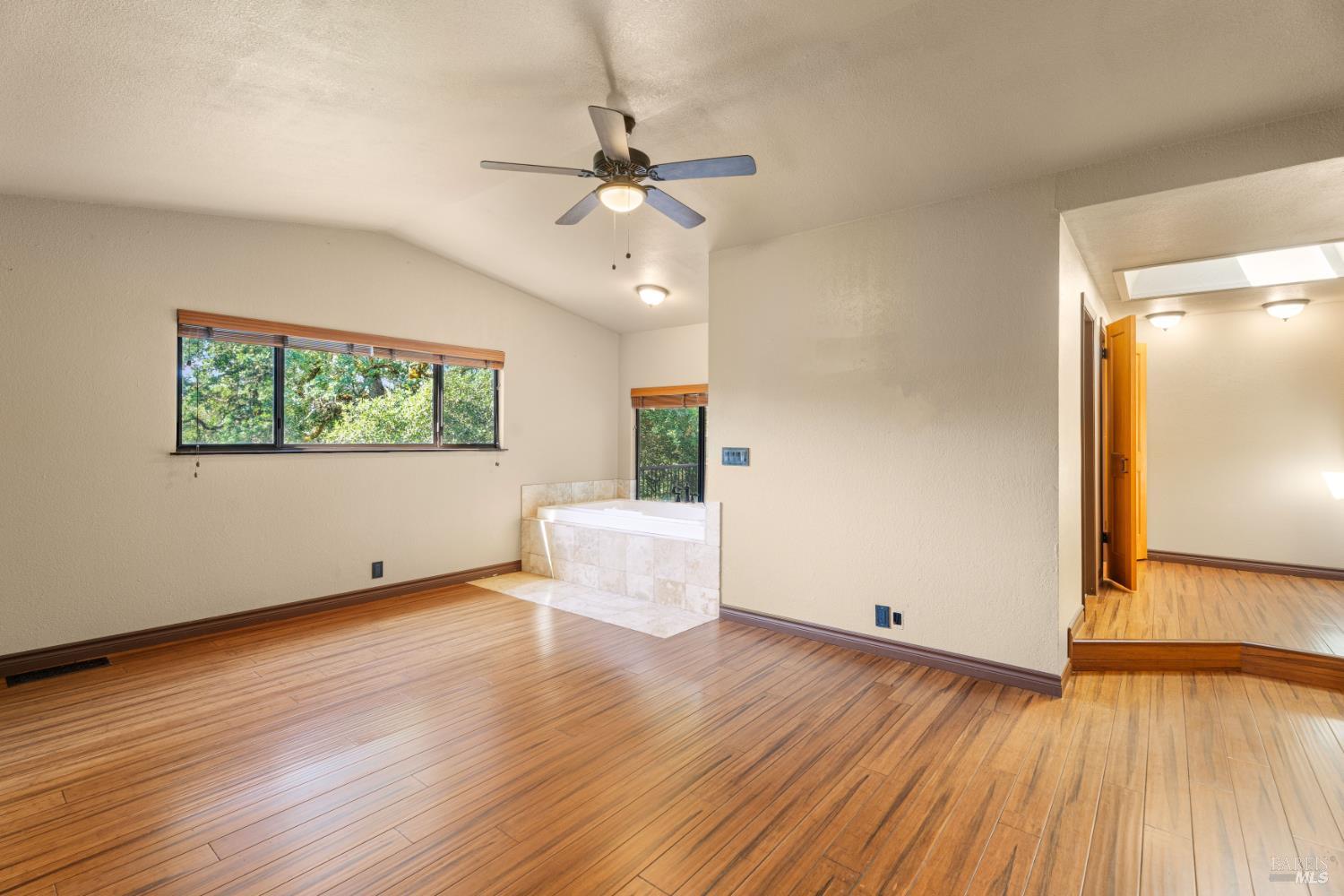 888 Watson Road Ukiah, CA 95482 - Photo 17 of 39 a view of an empty room with wooden floor and a window