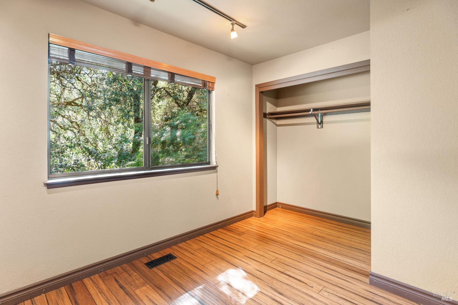 888 Watson Road Ukiah, CA 95482 - Photo 21 of 39 a view of empty room with wooden floor and fan