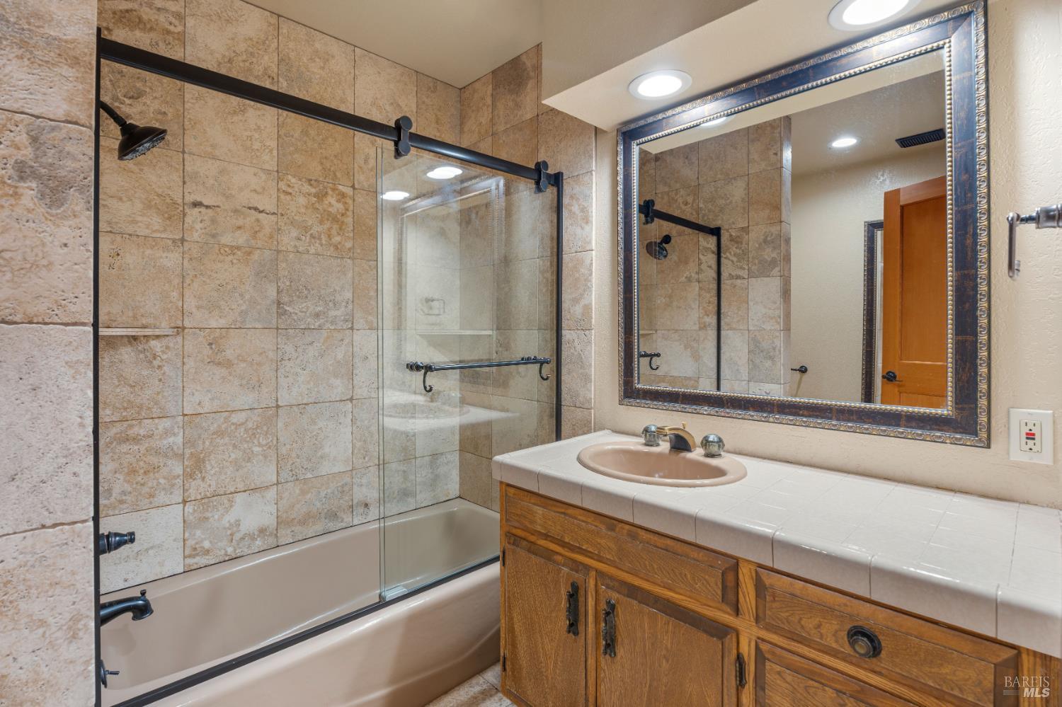 888 Watson Road Ukiah, CA 95482 - Photo 22 of 39 a bathroom with a shower sink and mirror