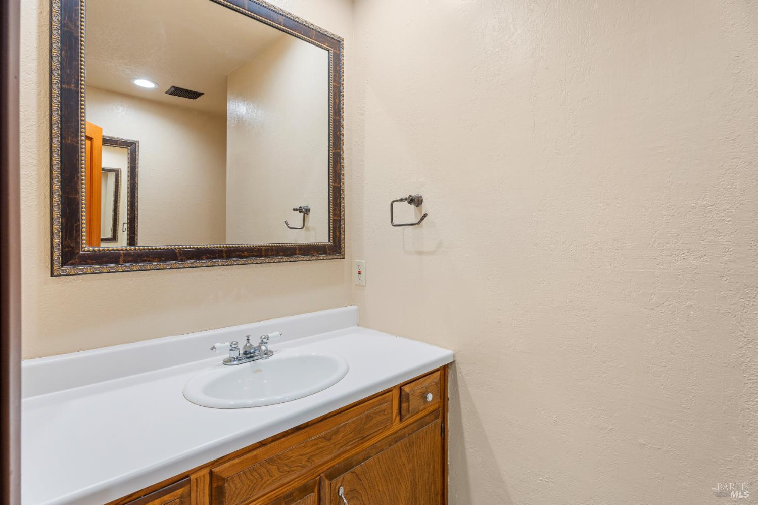888 Watson Road Ukiah, CA 95482 - Photo 26 of 39 a bathroom with a sink and a mirror
