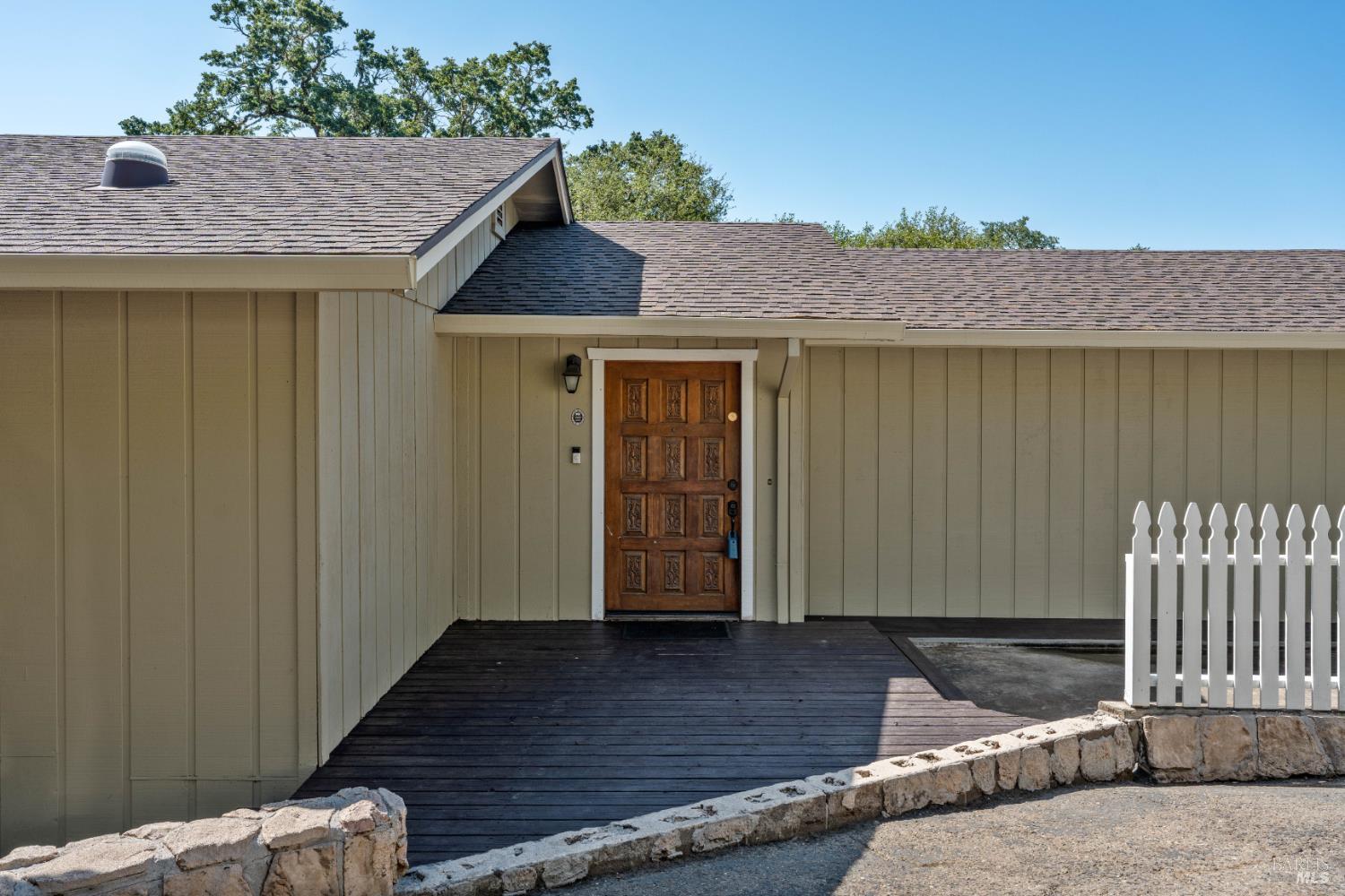 888 Watson Road Ukiah, CA 95482 - Photo 35 of 39 a front view of a house with a wooden fence