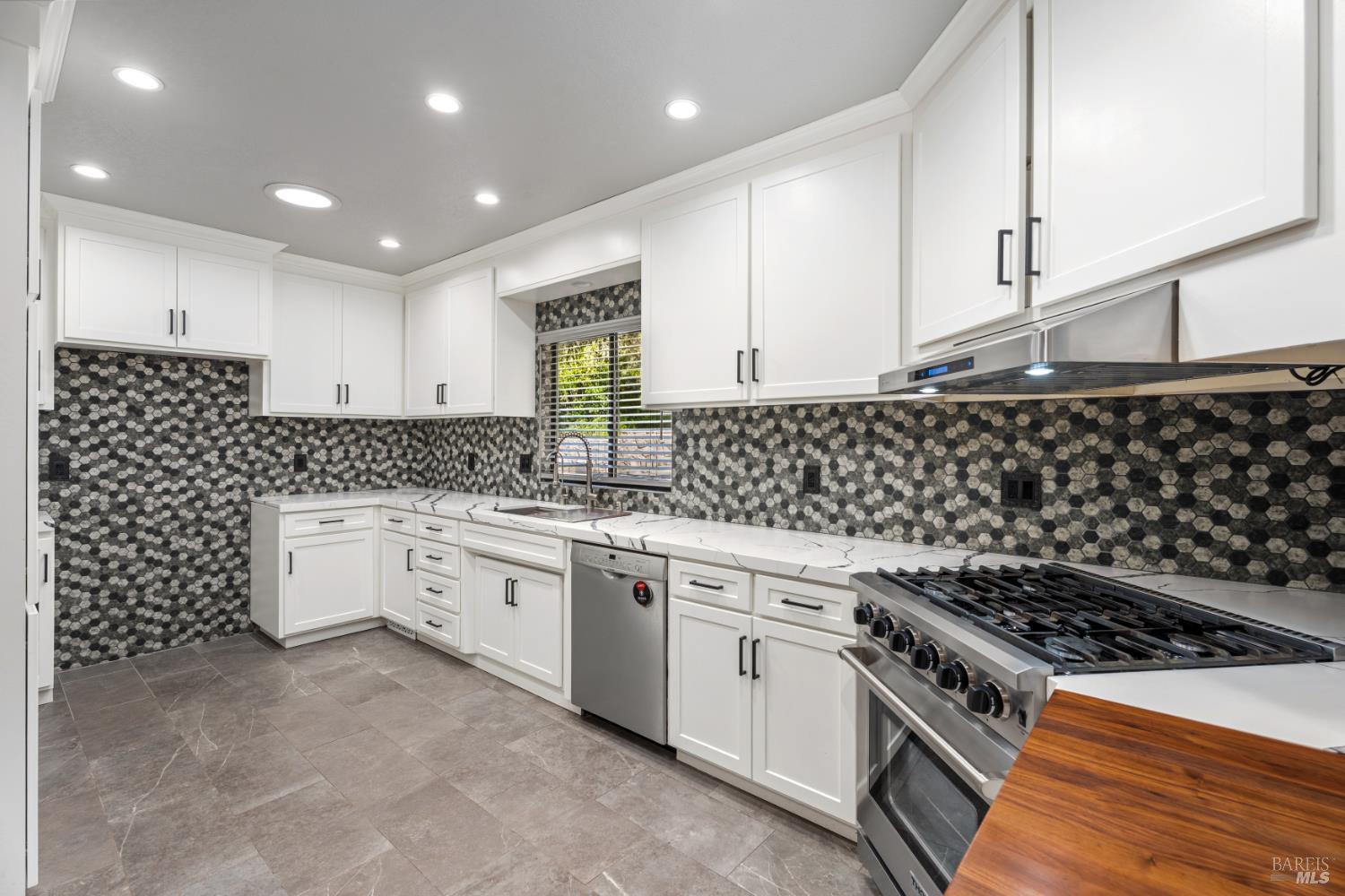 888 Watson Road Ukiah, CA 95482 - Photo 7 of 39 a kitchen with white cabinets and appliances