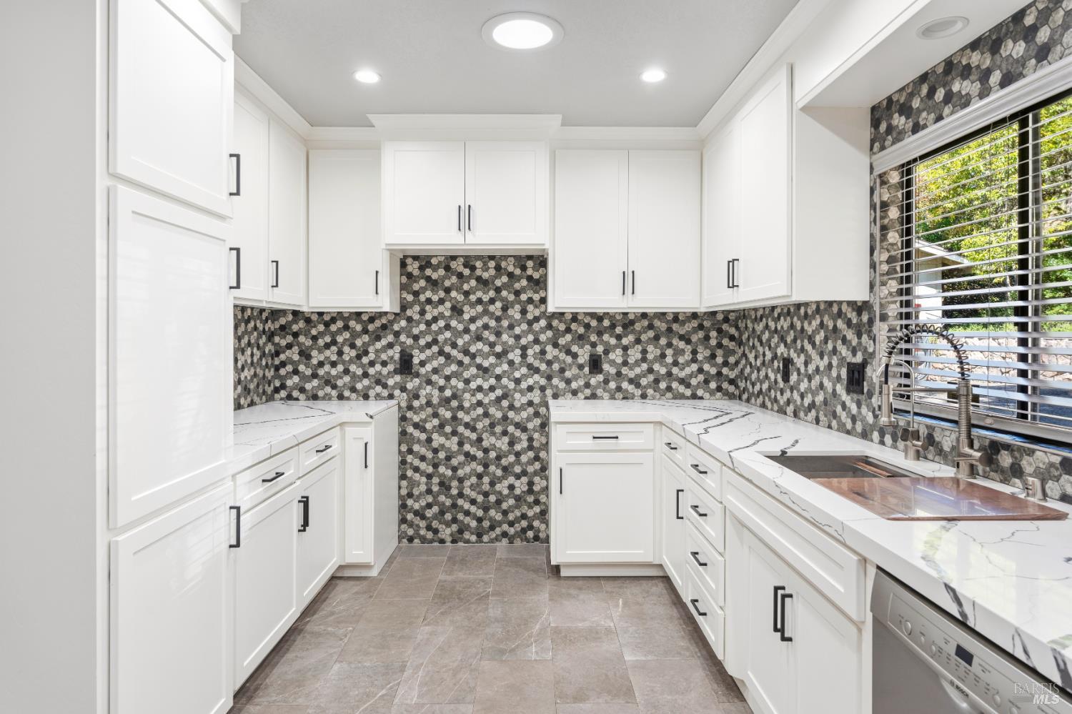 888 Watson Road Ukiah, CA 95482 - Photo 8 of 39 a kitchen with white cabinets a sink stove and granite counter top