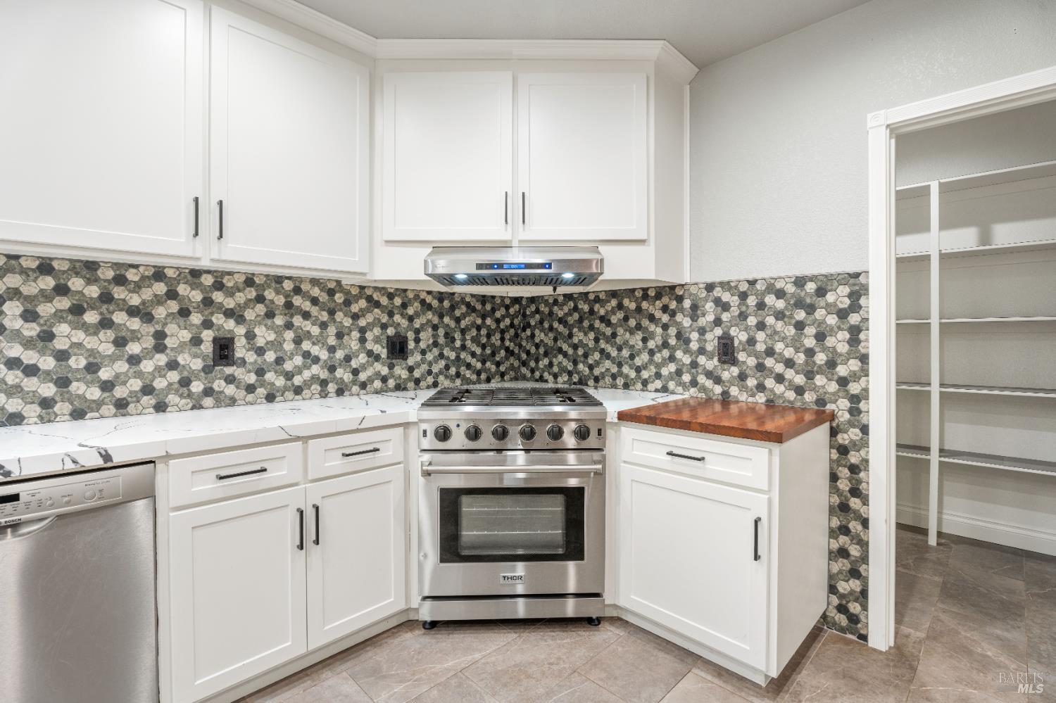 888 Watson Road Ukiah, CA 95482 - Photo 9 of 39 a kitchen with granite countertop white cabinets and white stove