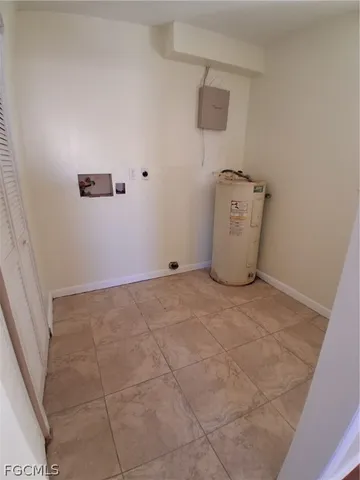 a bathroom with a sink toilet and window