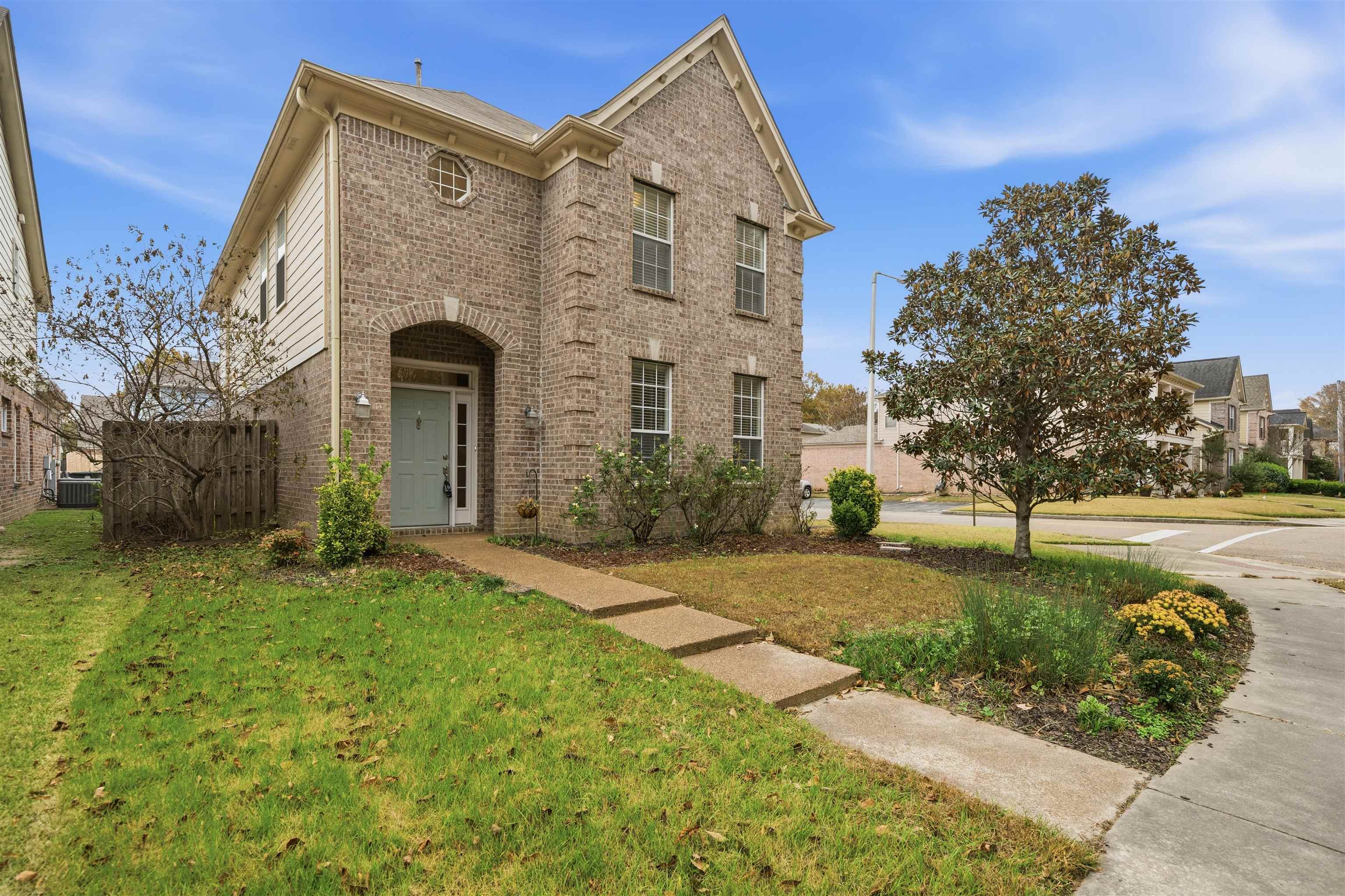 front view of a house with a yard