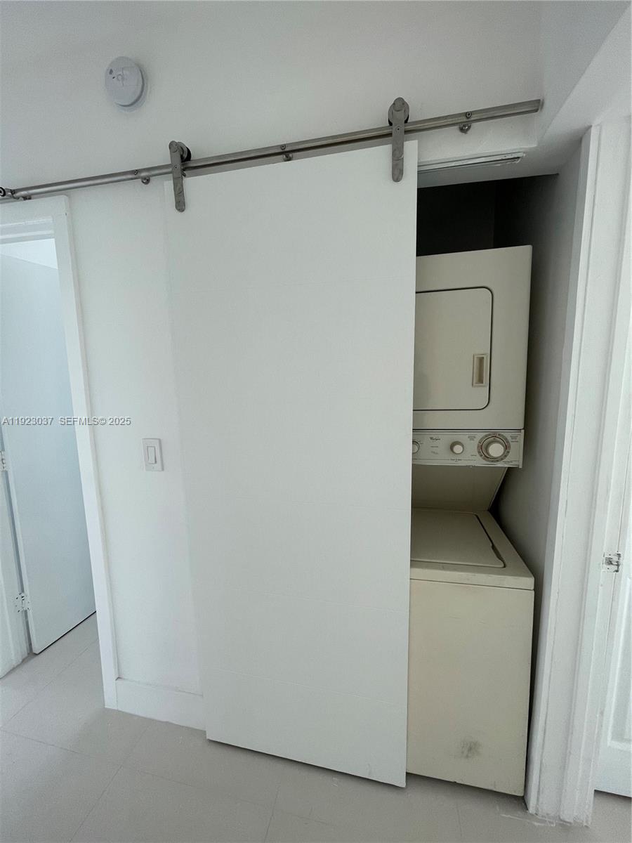 8215 Crespi Boulevard, Unit 4 Miami Beach, FL 33141 - Photo 11 of 34 a close view of a utility room with dryer and washer