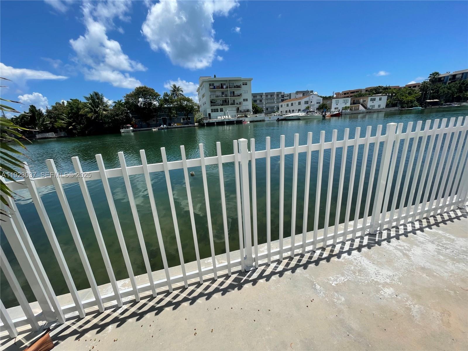 8215 Crespi Boulevard, Unit 4 Miami Beach, FL 33141 - Photo 21 of 34 a view of a wooden fence