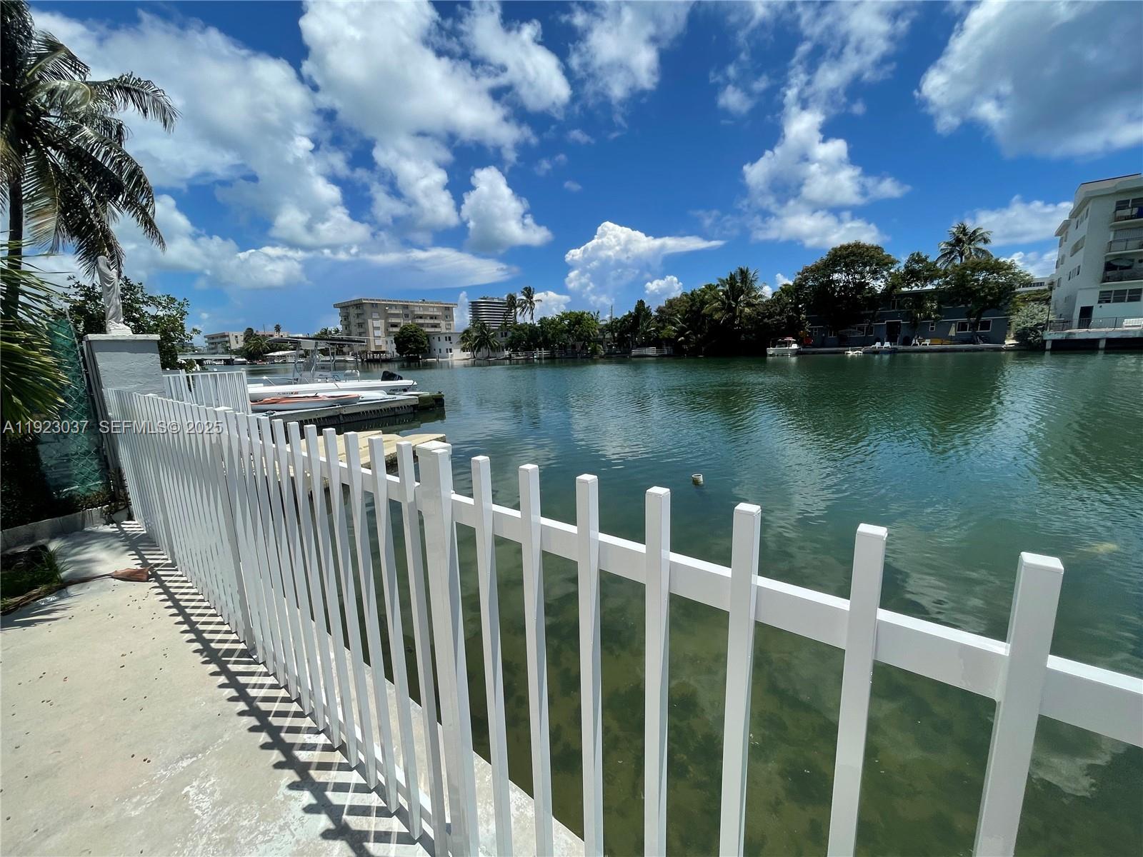 8215 Crespi Boulevard, Unit 4 Miami Beach, FL 33141 - Photo 22 of 34 a view of a lake with city from a lake