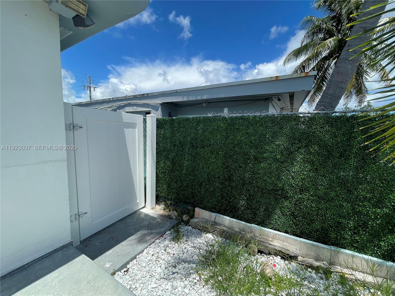 8215 Crespi Boulevard, Unit 4 Miami Beach, FL 33141 - Photo 26 of 34 a view of a porch in front of house