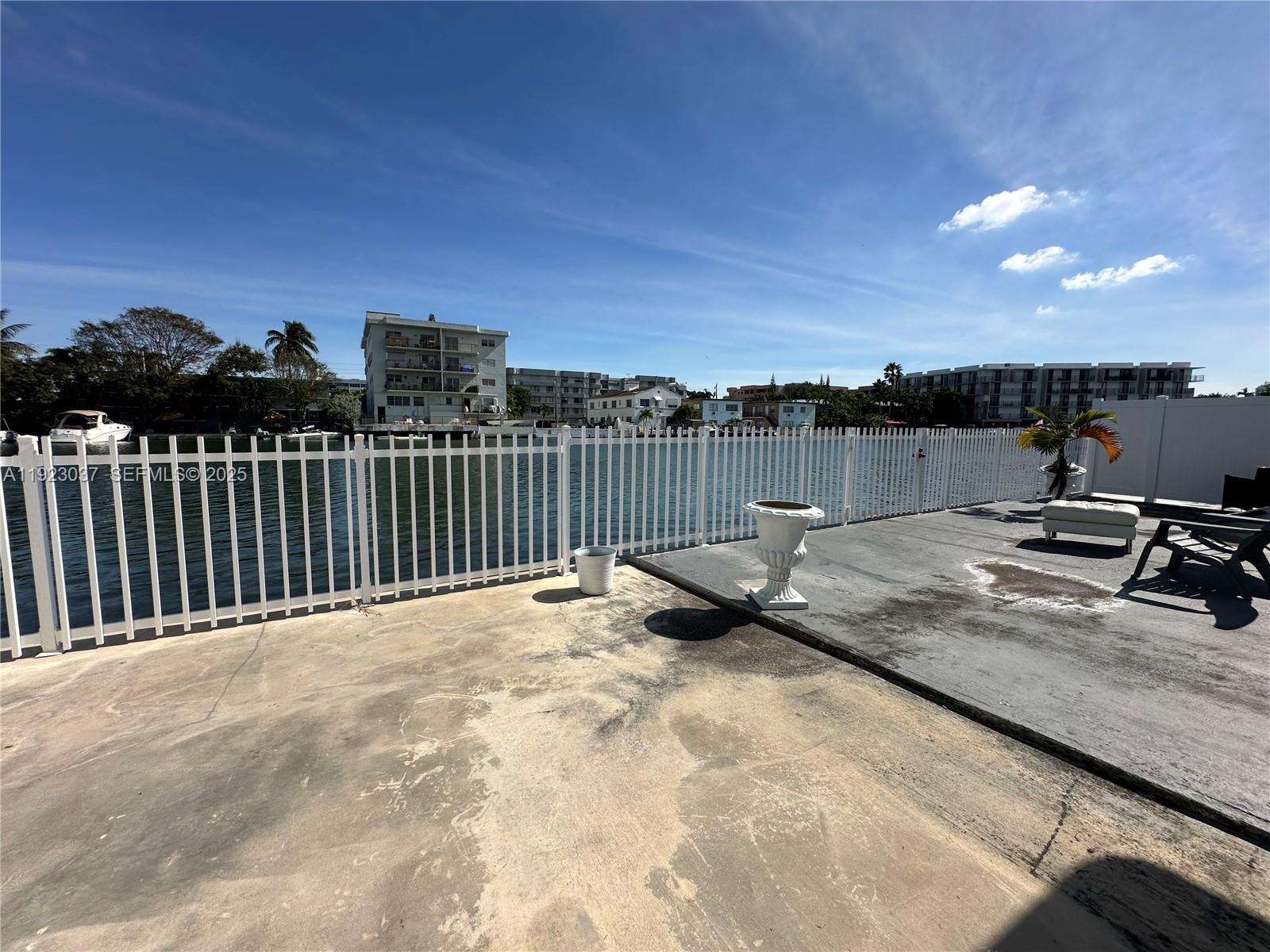 8215 Crespi Boulevard, Unit 4 Miami Beach, FL 33141 - Photo 33 of 34 a view of a terrace with a bench