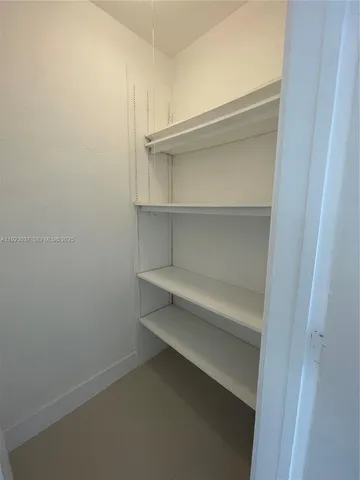 a view of an empty walk in closet