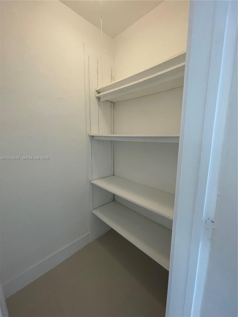 8215 Crespi Boulevard, Unit 4 Miami Beach, FL 33141 - Photo 10 of 34 a view of an empty walk in closet